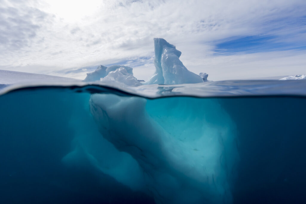 Typically around 80-90 percent of an iceberg mass lies beneath the water.